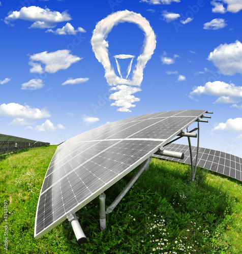 Foto: Bulb from clouds above the solar energy panels Bulb from clouds above the solar energy panels