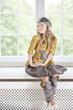 Girl sitting on the windowsill