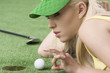 Foto: girl's playing with golf ball, she is in profile girl's playing with golf ball, she is in profile