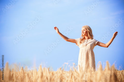 Photo: young beautiful woman on field young beautiful woman on field