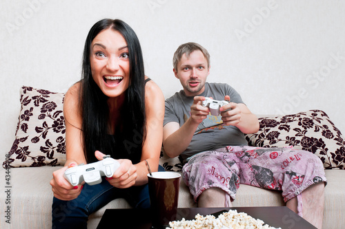 Photo: Young Couple Playing Computer Game Young Couple Playing Computer Game