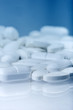 Lots of pills on blue background