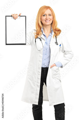 Photo: Female doctor holding a clipboard Female doctor holding a clipboard
