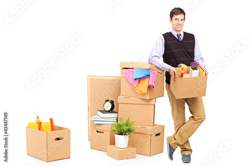 Photo: Person with moving boxes and other stuff Person with moving boxes and other stuff