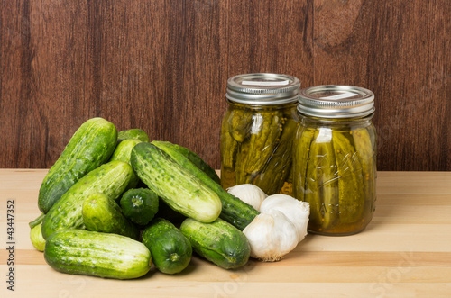 Photo: Pickles garlic and finished jars Pickles garlic and finished jars