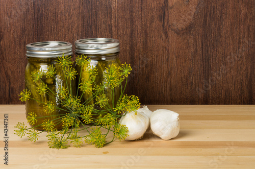 Photo: Two jars of pickles with dill Two jars of pickles with dill