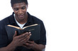 Young black man reading bible