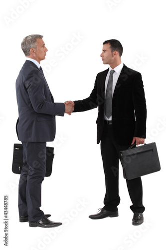 Photo: Business men shaking hands Business men shaking hands