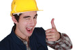 Tradesman winking and giving the thumb's up
