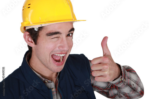 Photo: Tradesman winking and giving the thumb's up Tradesman winking and giving the thumb's up