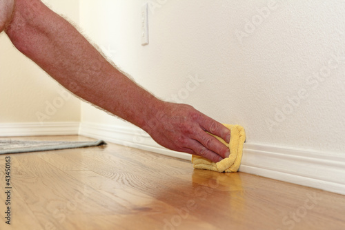 Photo: Dusting a Baseboard Dusting a Baseboard