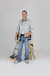 Carpenter posing by his equipment