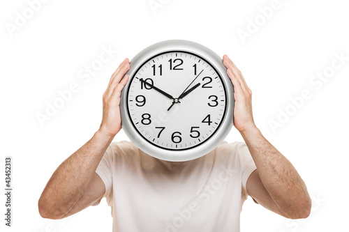 Photo: Man hand holding clock isolated Man hand holding clock isolated