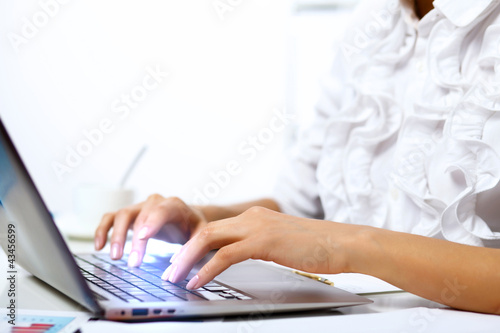 Photo: Business person working on computer Business person working on computer