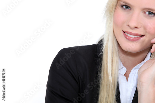 Foto: Studio closeup of young beautiful blonde in a suit Studio closeup of young beautiful blonde in a suit