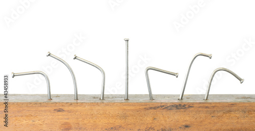 Photo: Nails in wooden plank. Nails in wooden plank.