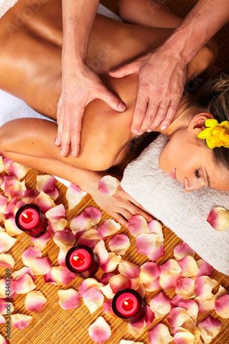 Photo: Young woman in Spa massage salon. Young woman in Spa massage salon.
