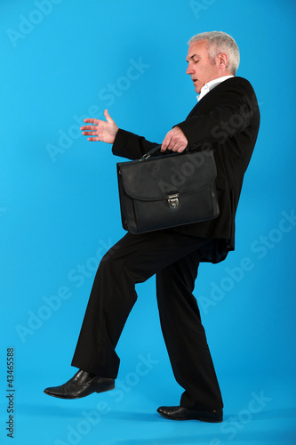Photo: Businessman treading carefully Businessman treading carefully