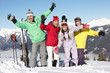 Teenage Family On Ski Holiday In Mountains
