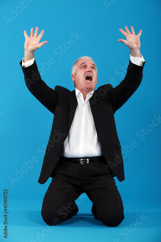 Photo: Man crying out in frustration Man crying out in frustration