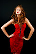 Photo: Beautiful, daring red-haired girl in a red dress Beautiful, daring red-haired girl in a red dress
