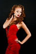 Photo: Beautiful, daring red-haired girl in a red dress Beautiful, daring red-haired girl in a red dress