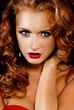 Photo: Beautiful, daring red-haired girl in red dress Beautiful, daring red-haired girl in red dress