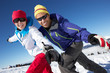 Couple Having Fun On Ski Holiday In Mountains