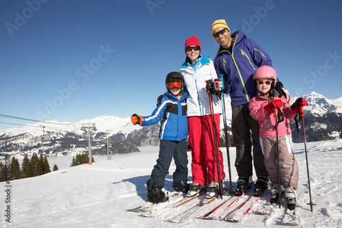Photo: Family On Ski Holiday In Mountains Family On Ski Holiday In Mountains