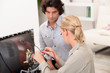 Couple repairing old television