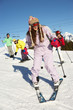 Teenage Family On Ski Holiday In Mountains