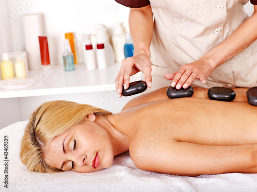 Photo: Woman getting massage . Woman getting massage .