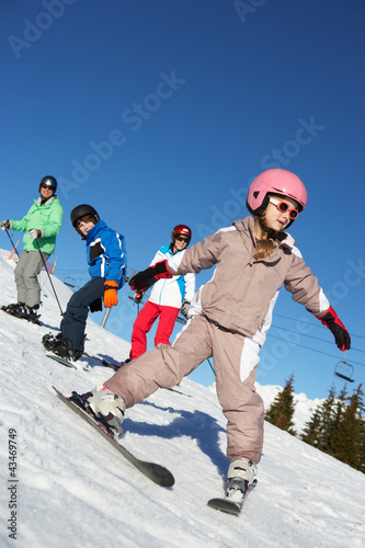 Photo: Family On Ski Holiday In Mountains Family On Ski Holiday In Mountains
