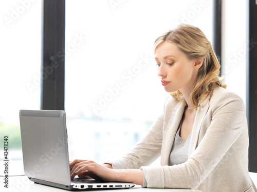 Photo: pensive woman with laptop computer pensive woman with laptop computer