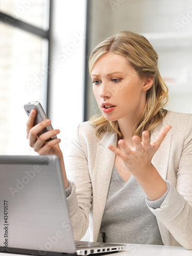 Photo: businesswoman with cell phone businesswoman with cell phone