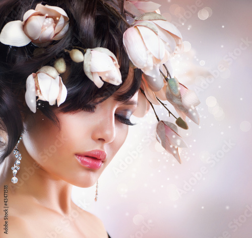 Photo: Fashion Brunette Girl with Magnolia. Hairstyle. Fashion Brunette Girl with Magnolia. Hairstyle.