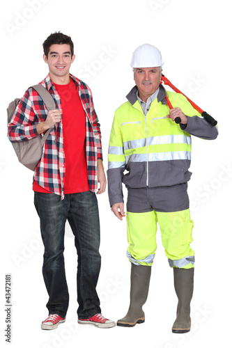 Photo: A mature construction worker and his grandson. A mature construction worker and his grandson.