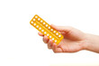 Foto: woman holding birth control pills woman holding birth control pills