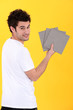 Man holding bathroom tiles
