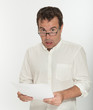 Scared man reading a document