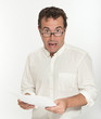 Scared man reading a document