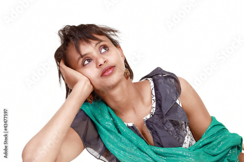 Photo: Daydreaming pretty woman staring at copy space Daydreaming pretty woman staring at copy space