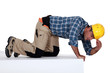 builder climbing on wall being curious