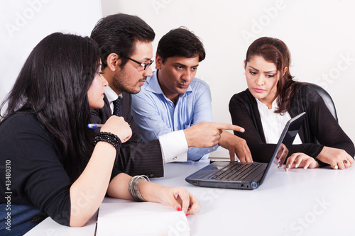 Photo: group of young multi racial business people in meeting group of young multi racial business people in meeting
