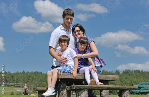Photo: happy young family have fun outdoors happy young family have fun outdoors
