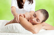 Foto: Beautiful woman at massage procedure Beautiful woman at massage procedure