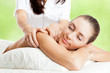 Foto: Beautiful woman at massage procedure Beautiful woman at massage procedure