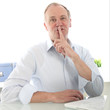 Man giving a shushing gesture with his finger