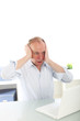 Man reacting in shock to his laptop
