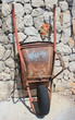 rusty old wheelbarrow